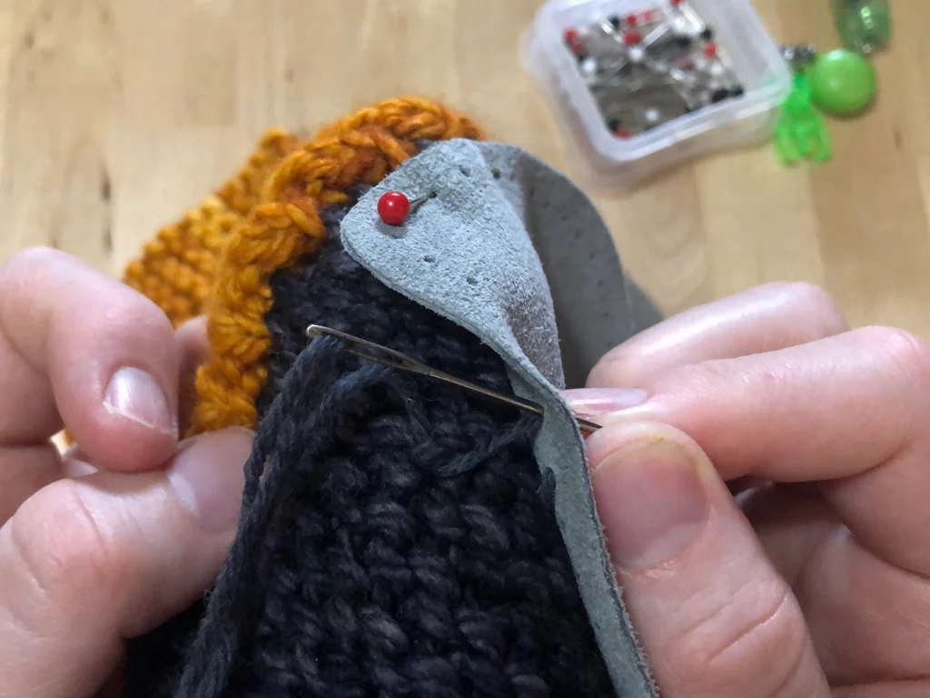 Learn how to sew soles onto your slippers for extra grip and added durability. #knitting | withwool.com