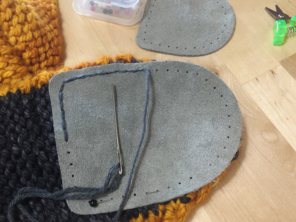 Learn how to sew soles onto your slippers for extra grip and added durability. #knitting | withwool.com