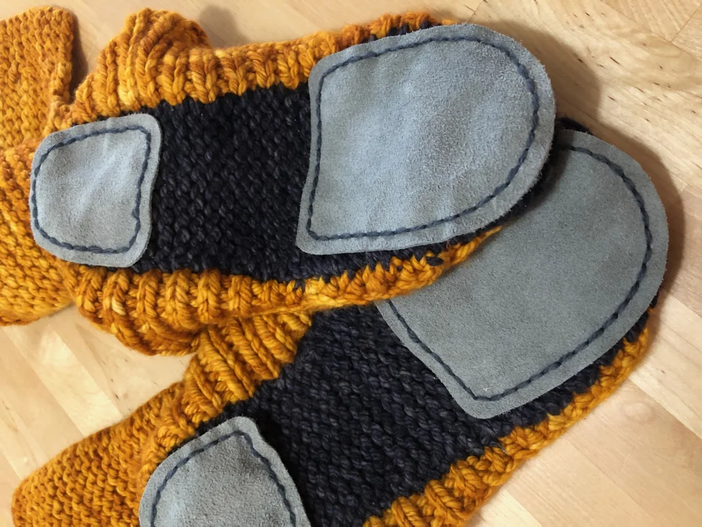 Learn how to sew soles onto your slippers for extra grip and added durability. #knitting | withwool.com