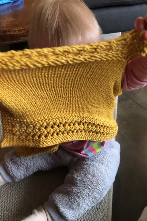 A cool and comfy baby sweater with room to grow. #knitting | withwool.com
