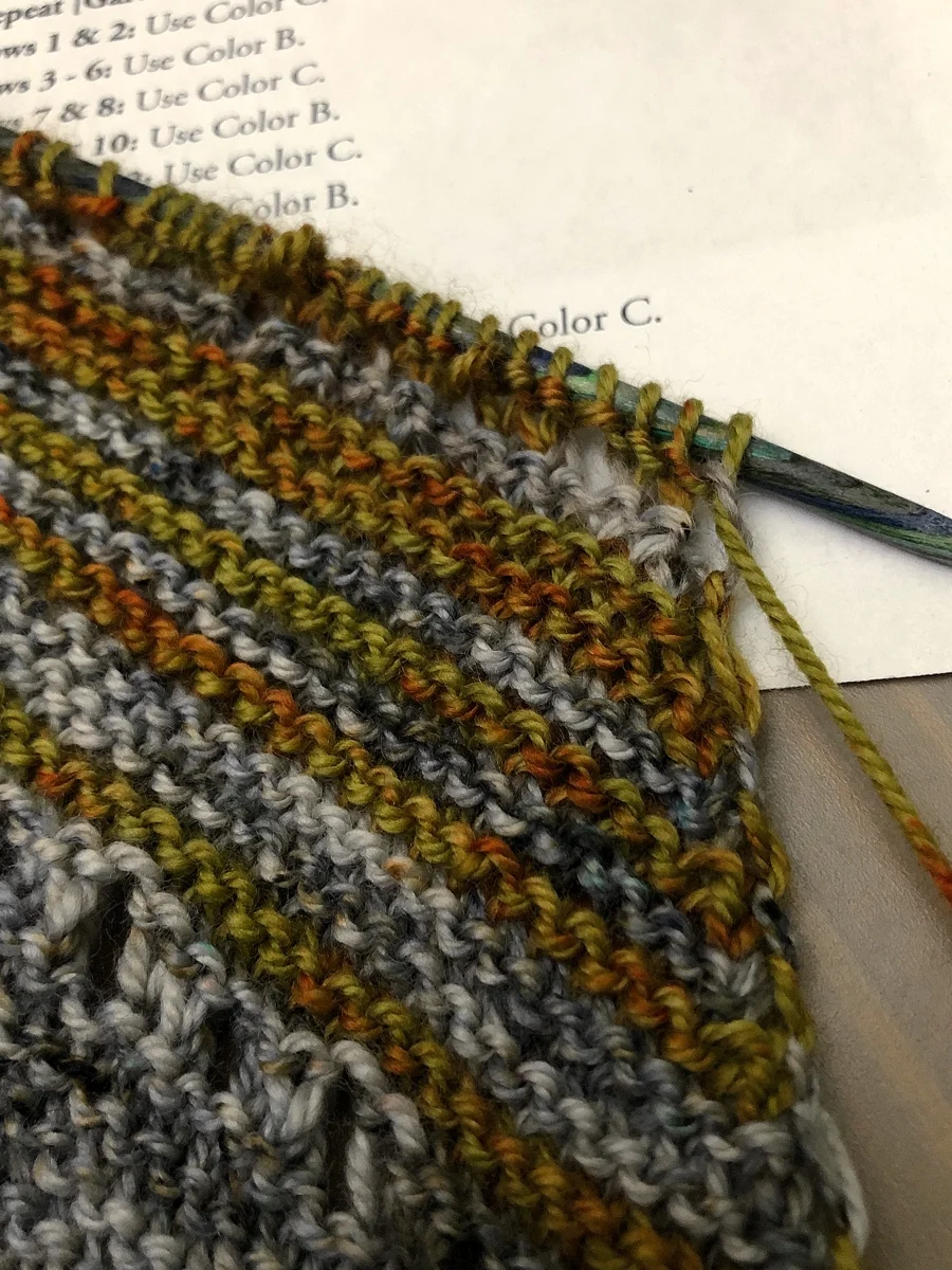 Ran out of yarn with just a few stitches left in the row. Sock yarn leftovers to the rescue! Yarn Chicken Shawl || withwool.com