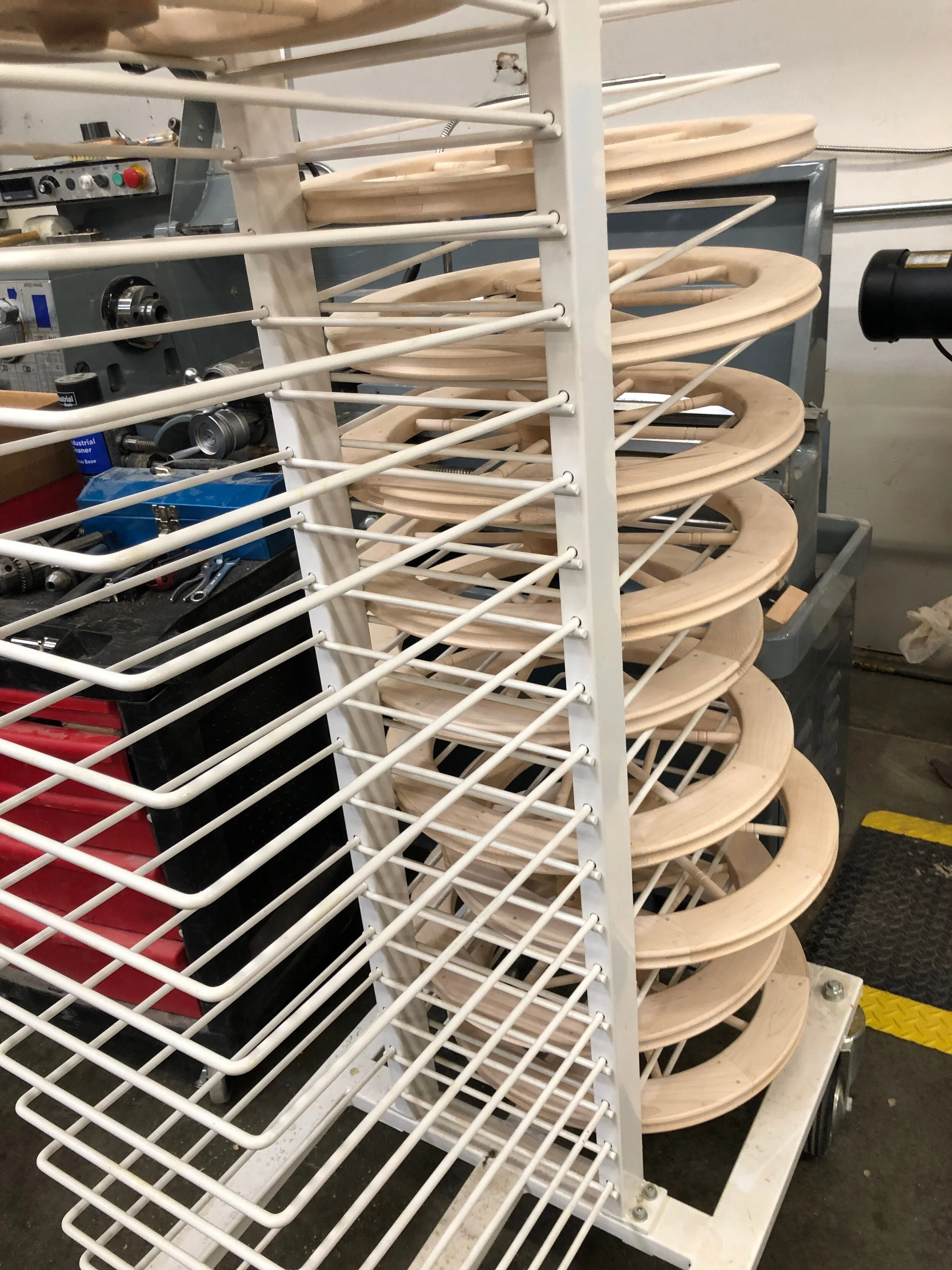 Assembled center wheels on a rack ready to go to finishing. Celebrating Schacht’s 50th Anniversary || withwool.com #schacht50years