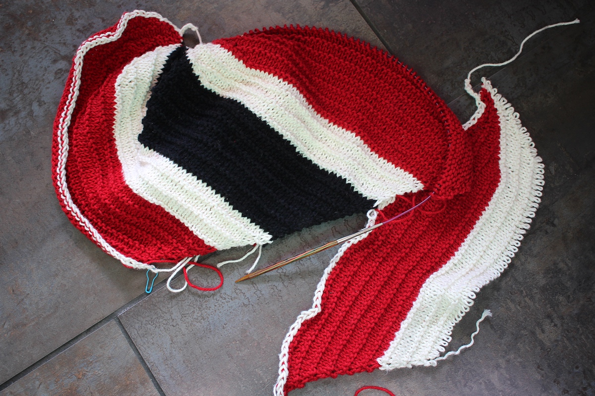 The first and second attempt at making the Cattywampus Hat look like the flag of Trinidad and Tobago. #knitting The second attempt is going much better, and in the right direction. Around Here || withwool.com