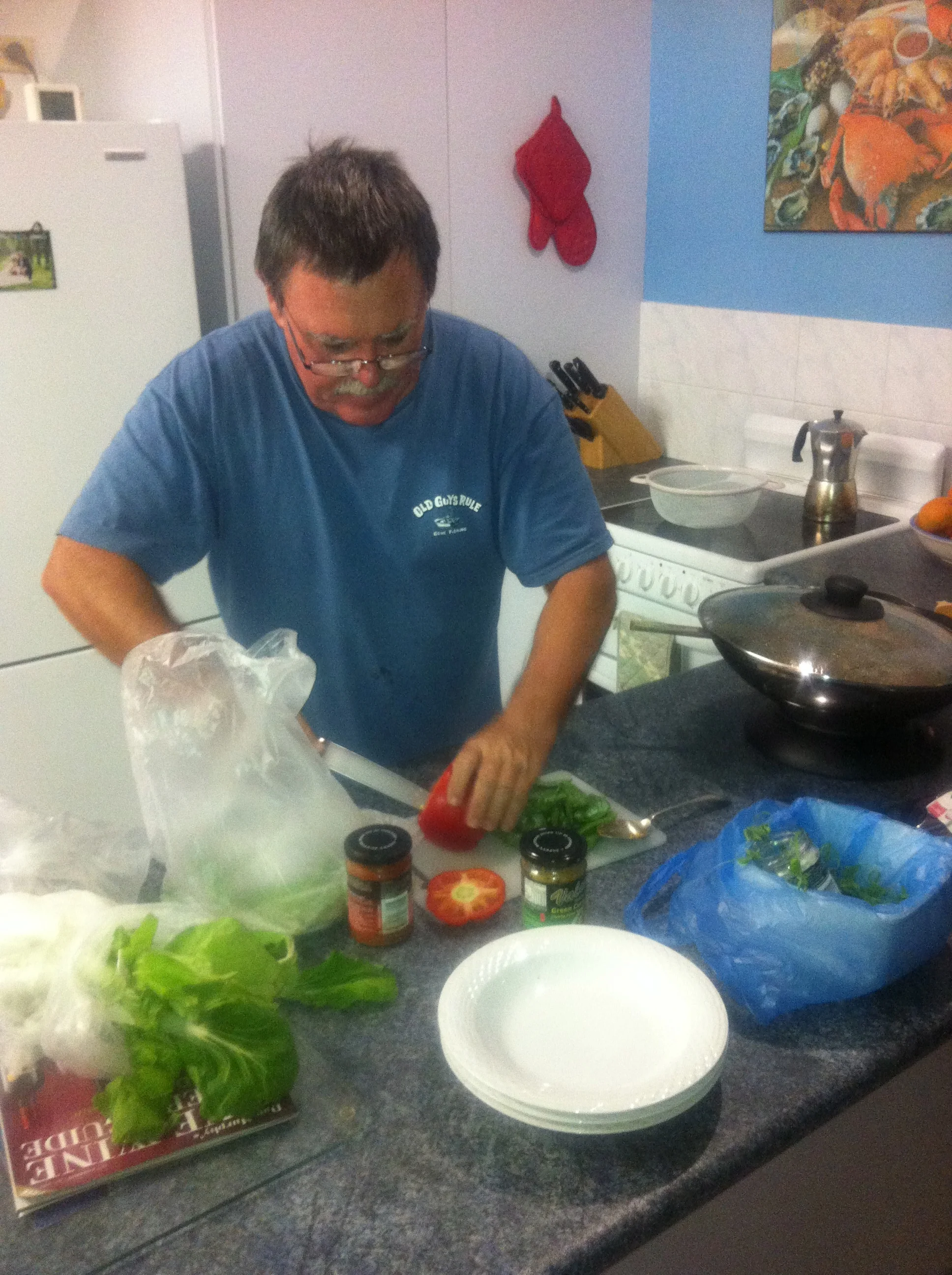 Dennis making dinner