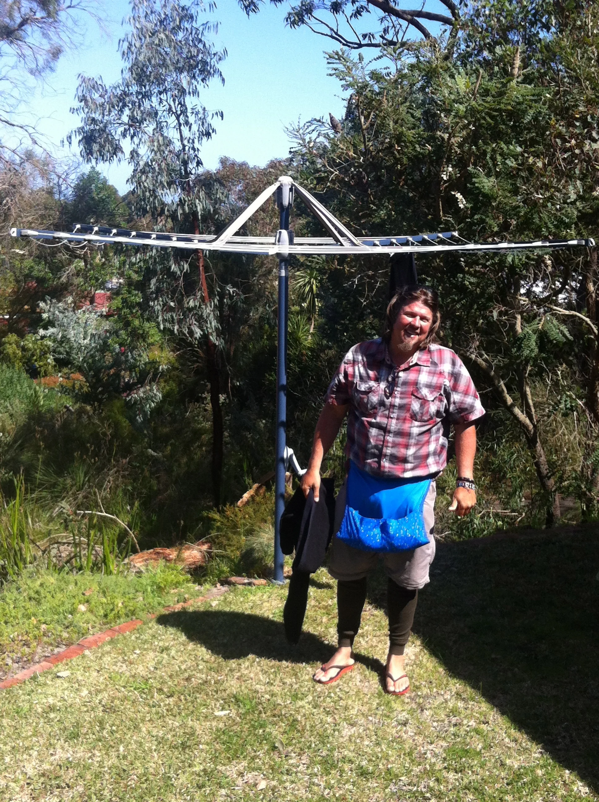 Kev hanging up a quick load of laundry before we hit the cliffs!.....Nice peg holder babe?
