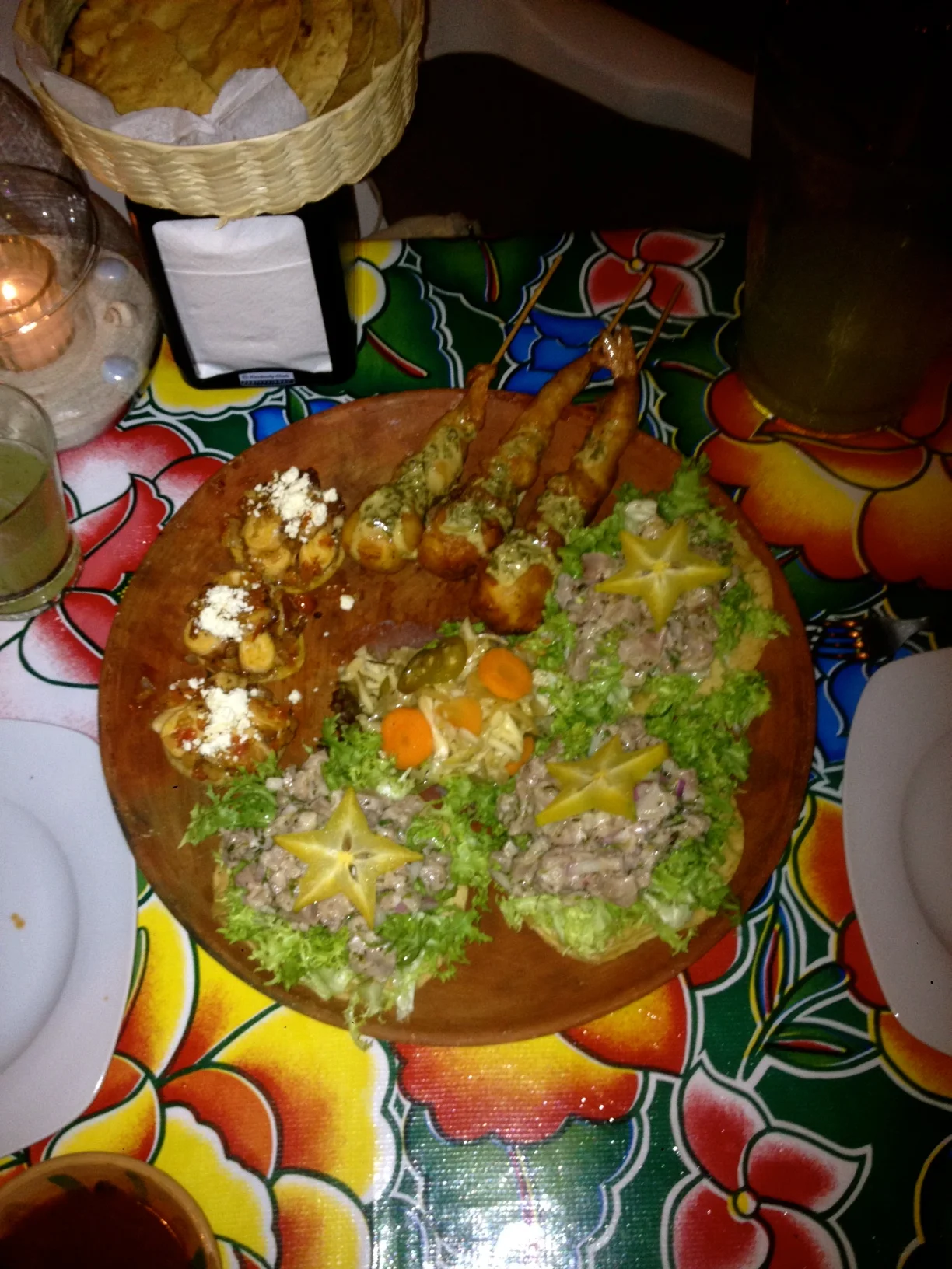 An amazing plate of fresh atun, tuna tostadas, pulpo, octopus sopes and a cameron, prawn paired with a local quseo crown, deep fried.