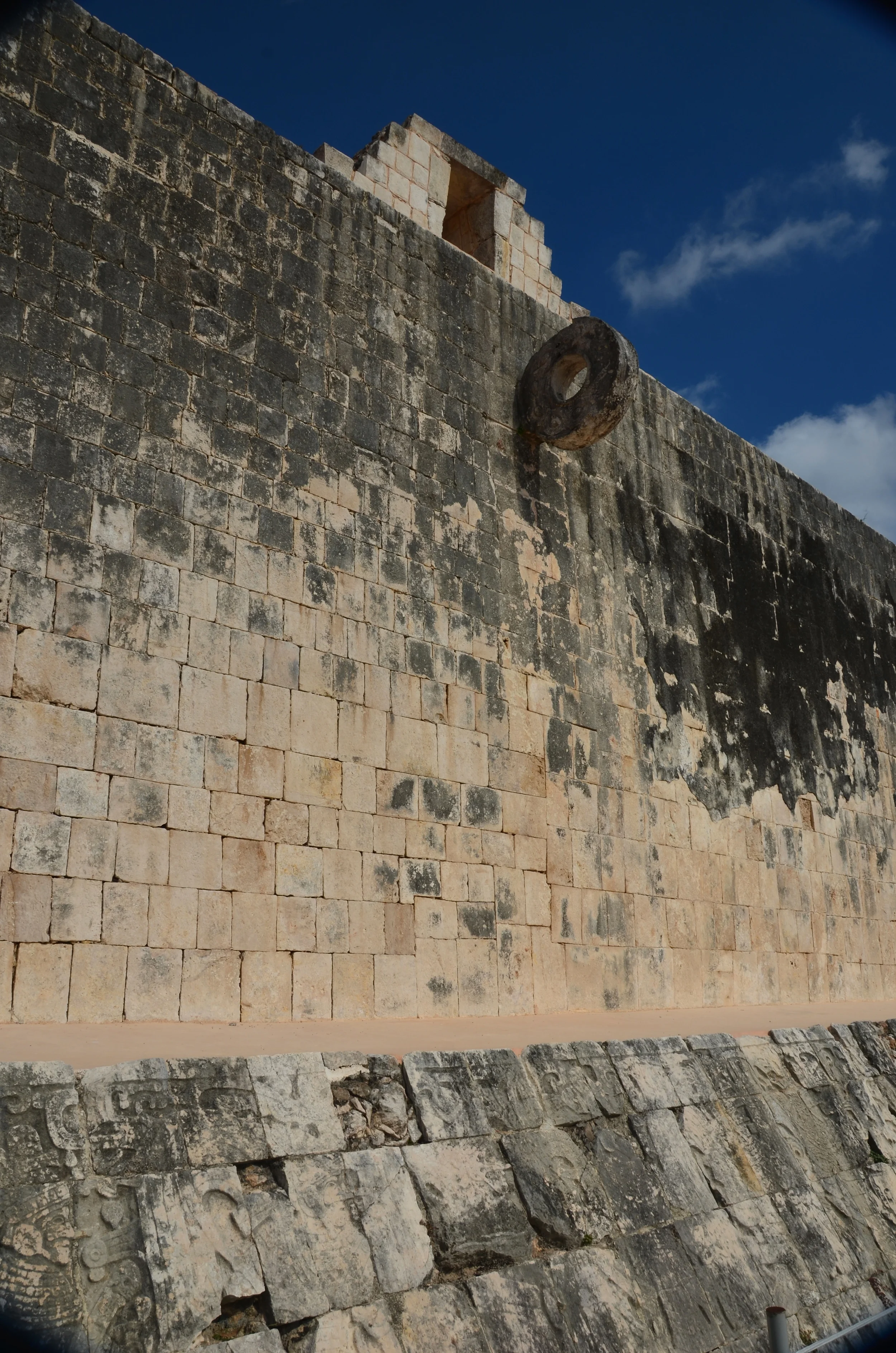 The walls are 8 meters/ 26 feet high and 95 meters/ 312 feet long. A carved ring is set high on each wall in the center of the court.