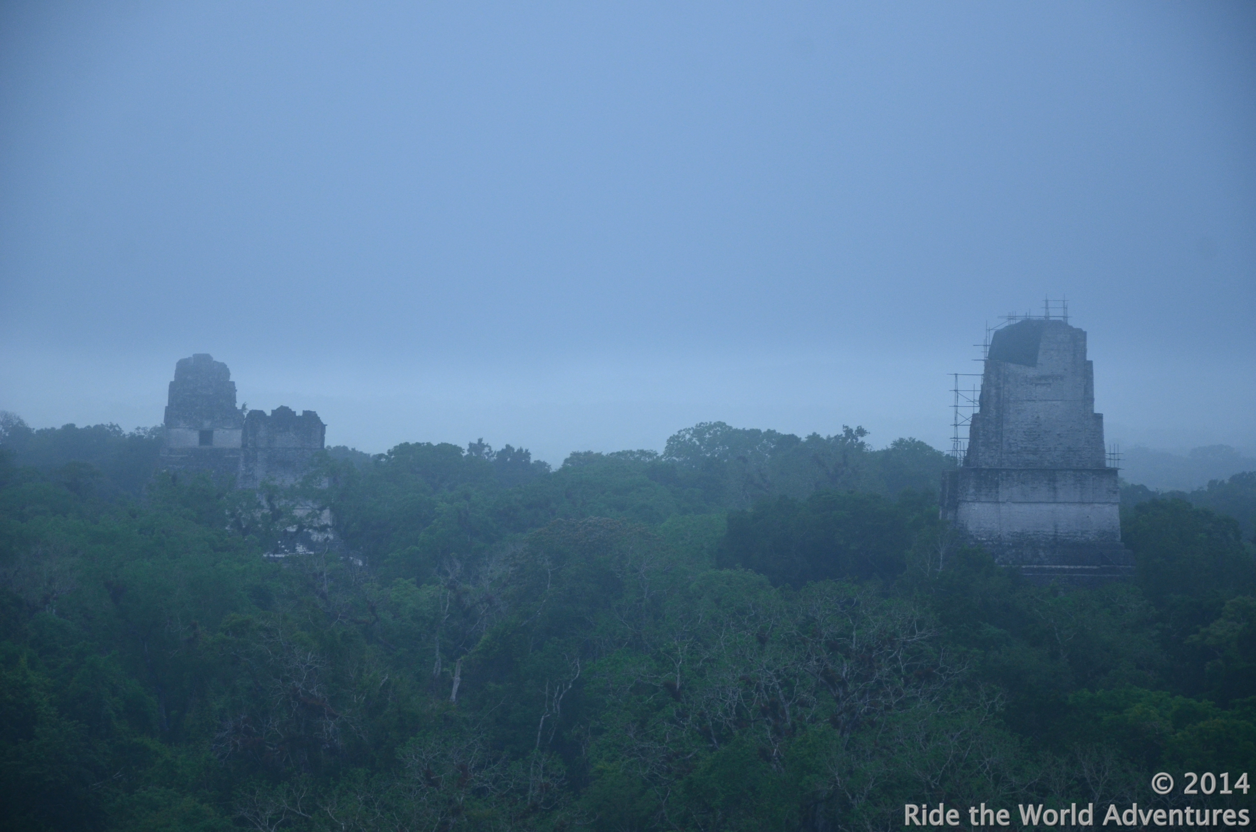 Waiting for the sunrise on the steep steps of the highest temple of Tikal (65 mts), perched high in the cool mist marveling over the wonders of the Tikal canopy. This temple was built in 745 A.D. and is known as the Temple of the Two Headed Snake.