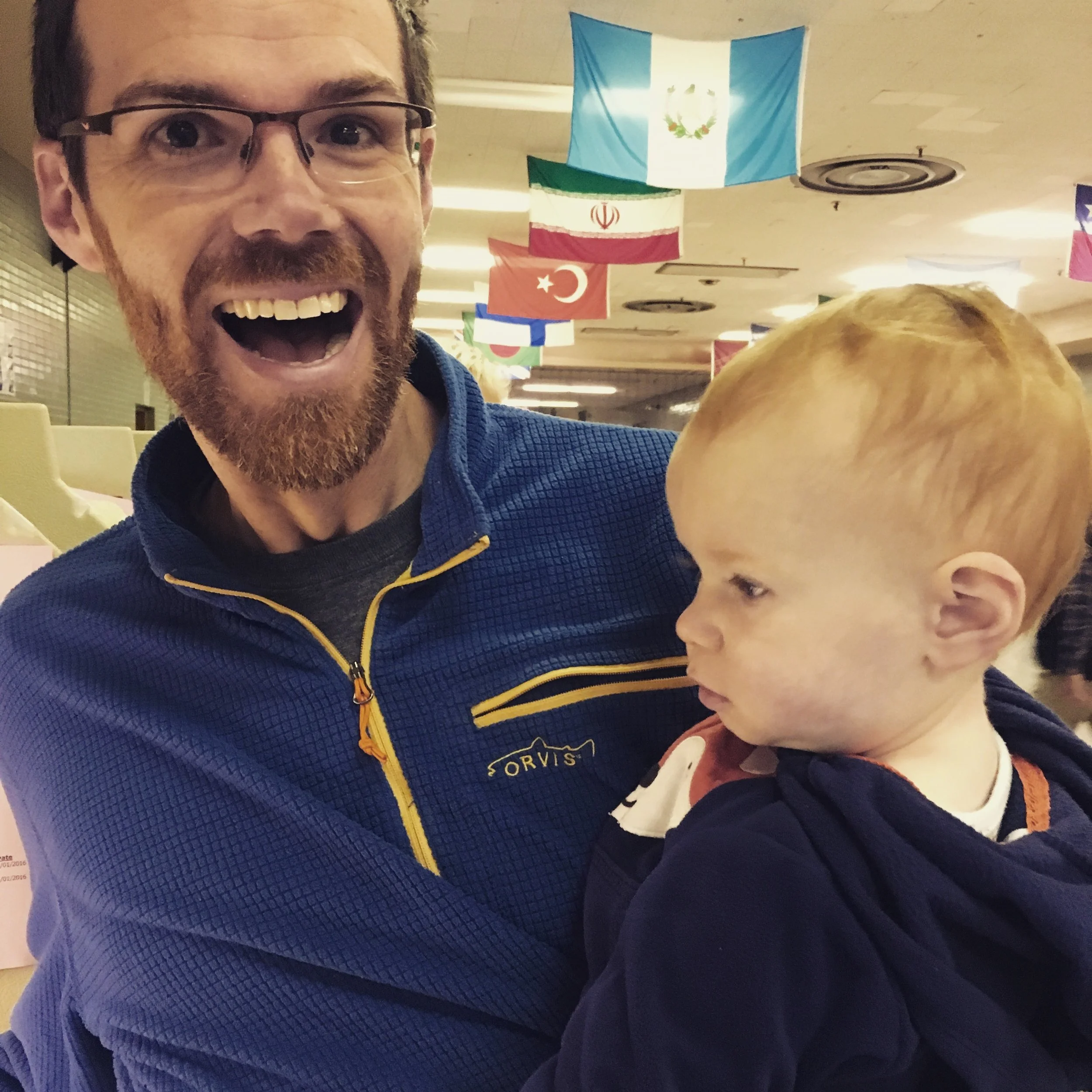 Me, far too excited to vote given that I was forced to show up at a certain place on a certain date as though the USPS doesn't exist and UVBM doesn't work already in three states. Also, my kid. 