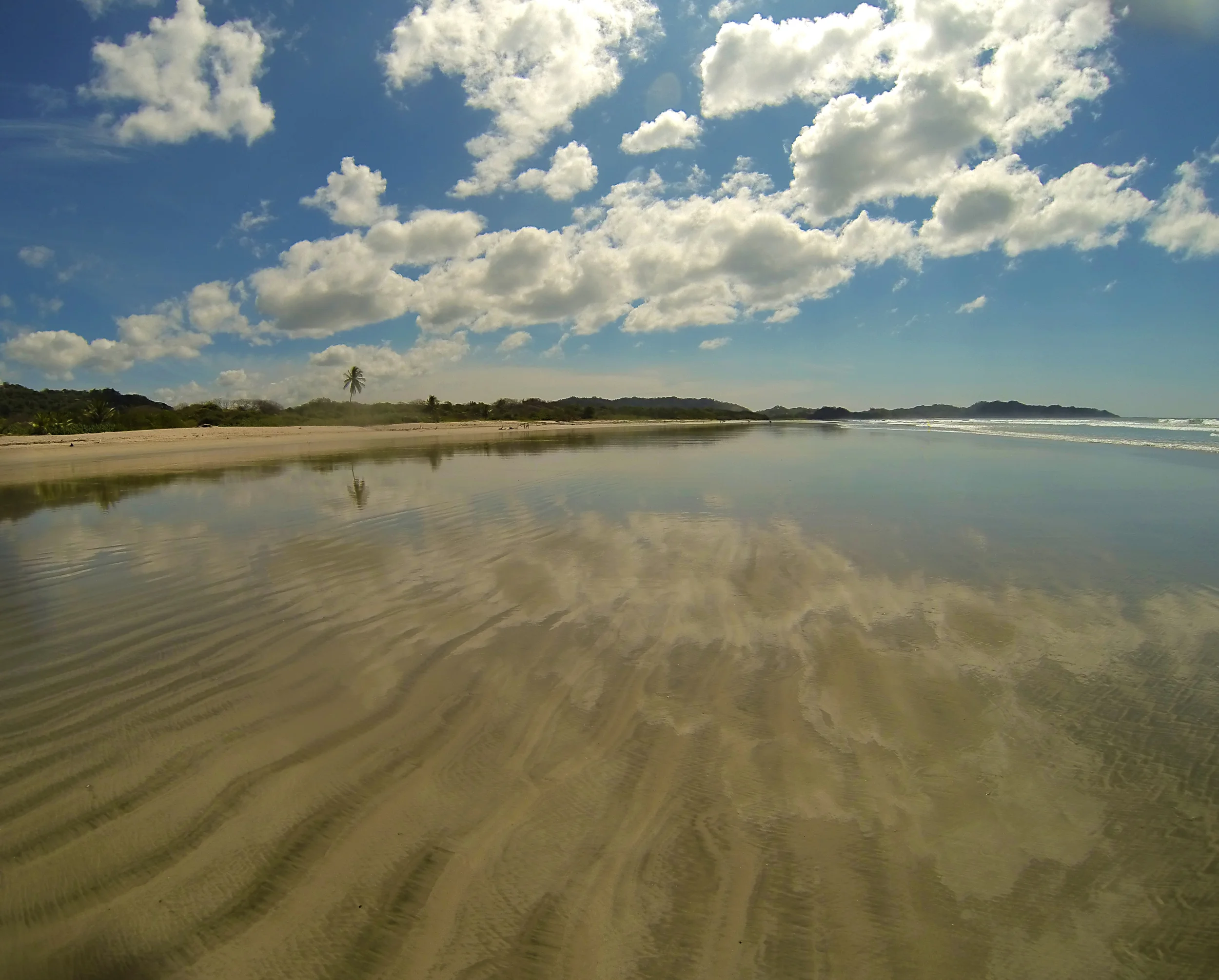 Empty beach in Costa Rica at low tide