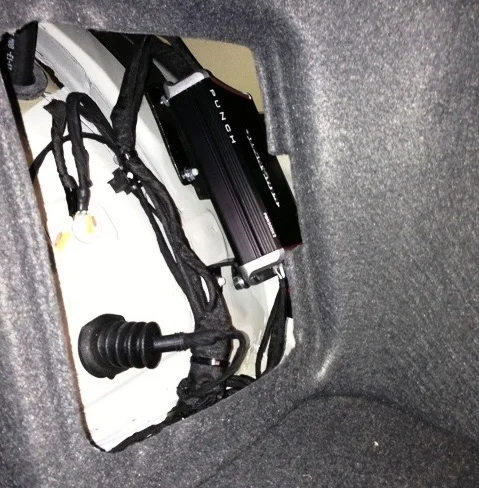 The tiny yet powerful Rockford Fosgate amplifier fits neatly inside the rear quarter panel storage on a set of custom made mounts.