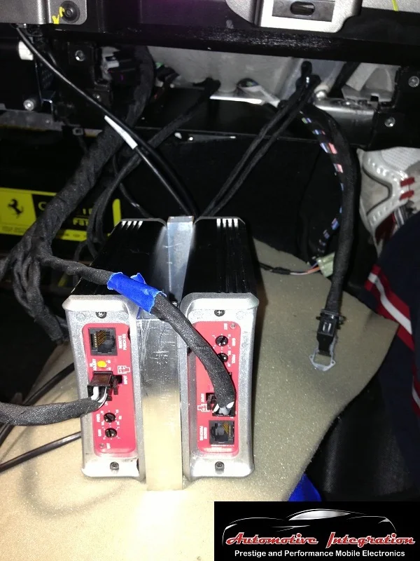 The custom amp rack was designed to slide into a small space in the dash and mount to factory bolts.