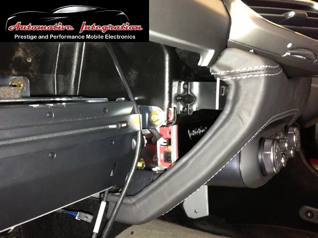 The duel amplifier rack fits perfectly out of sight behind the climate control.