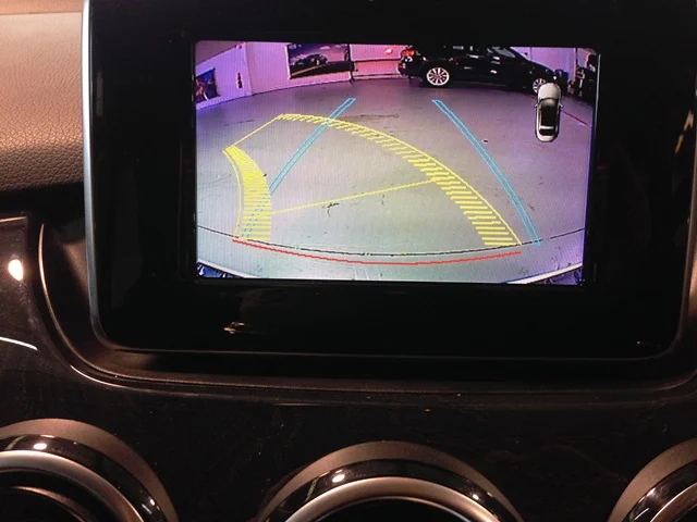 Mercedes Benz active rear camera system with predictive path and on screen parking sensor display.
