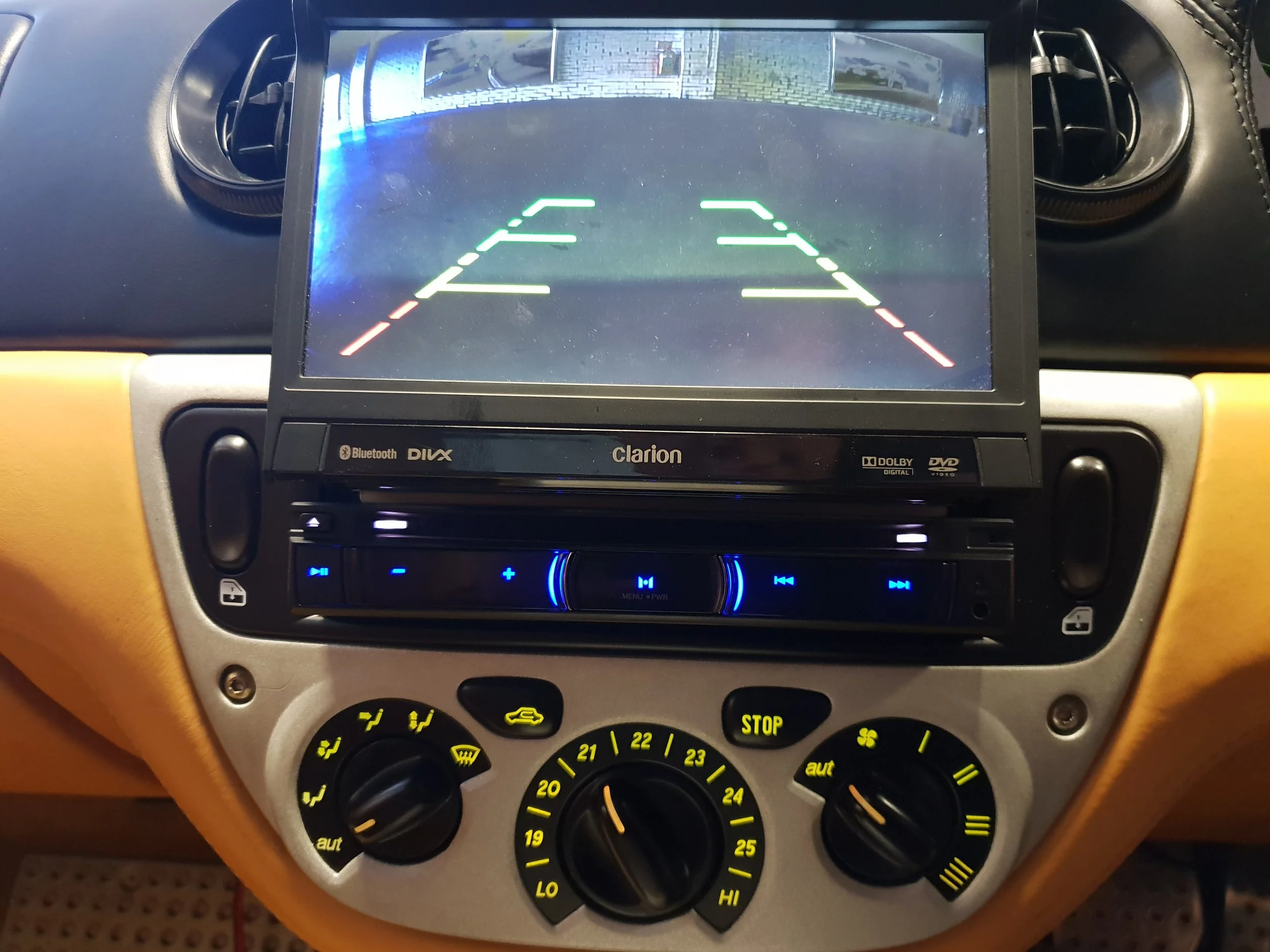 The rear camera displays on the screen automatically when the car is put into reverse