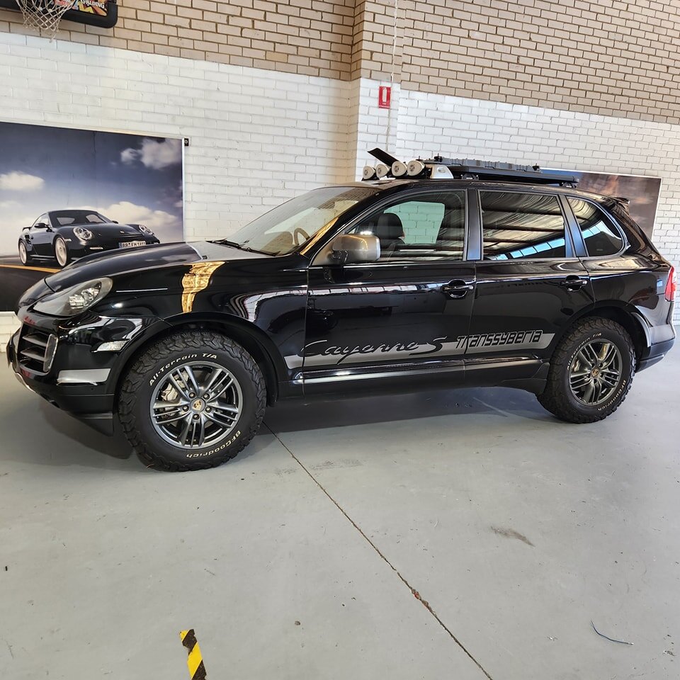 We're used to seeing rare Porsches in here, but it's very unusual to have one rumble up the driveway that isn't built just for speed. This Porsche Cayenne Transsyberia is one of just 285 built to commemorate Porsche's success at the Transsyberian Ral