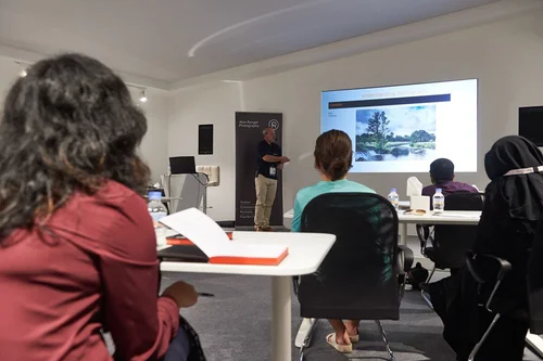 Photography training for a group with on-screen review