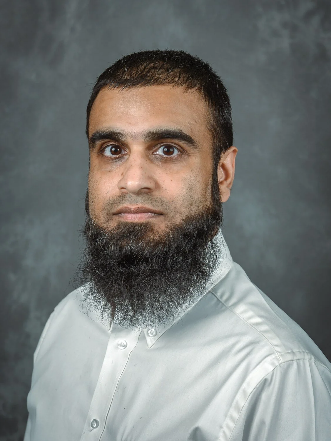 Corporate headshot photographed on location at a workplace