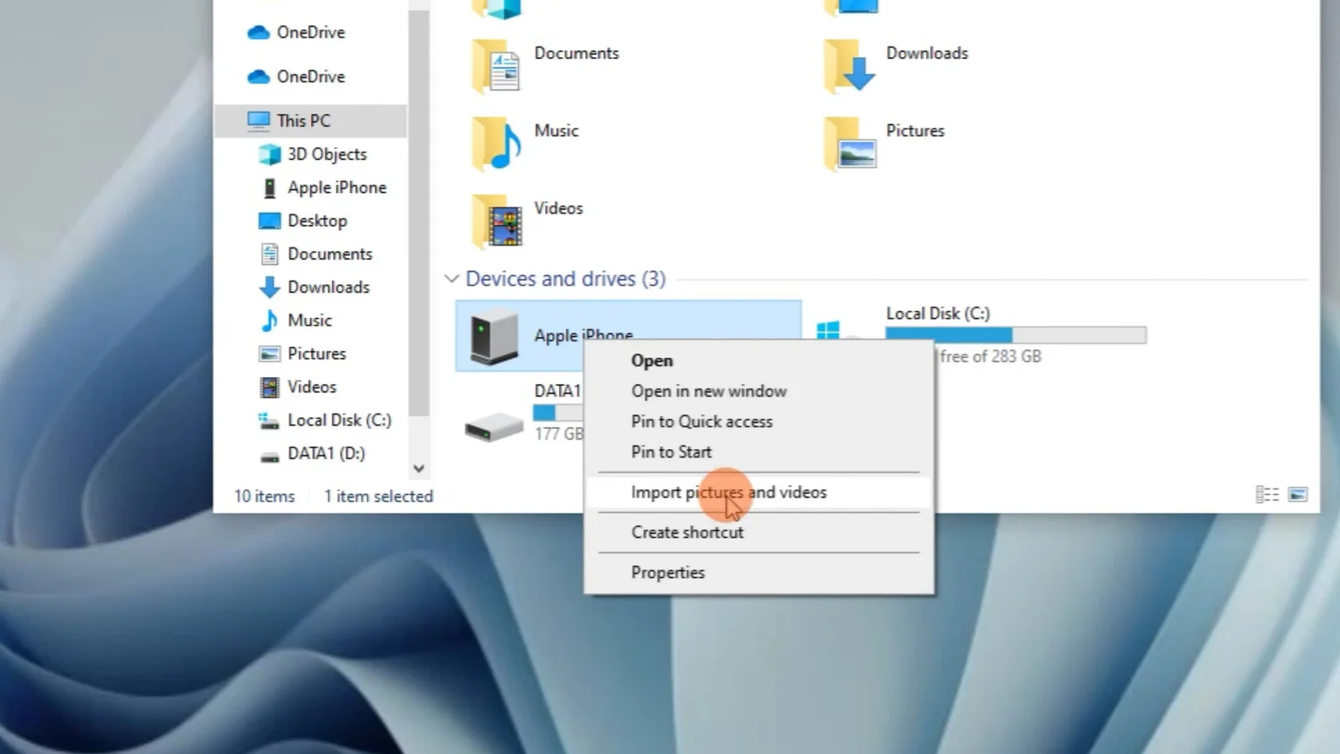 Opening the Import Pictures and Videos wizard for an iPhone in Windows