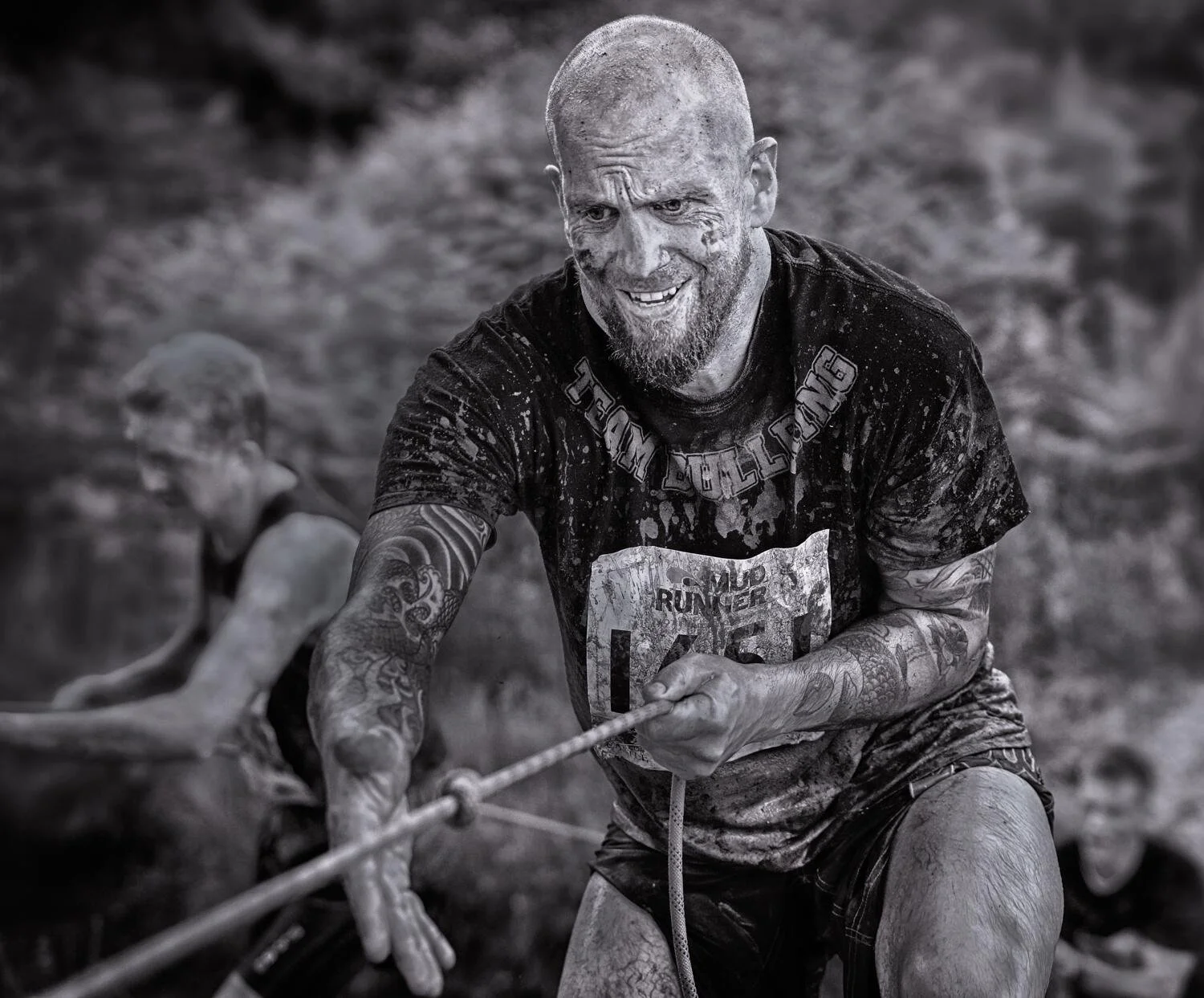 Exhausted mud runner after completing an obstacle