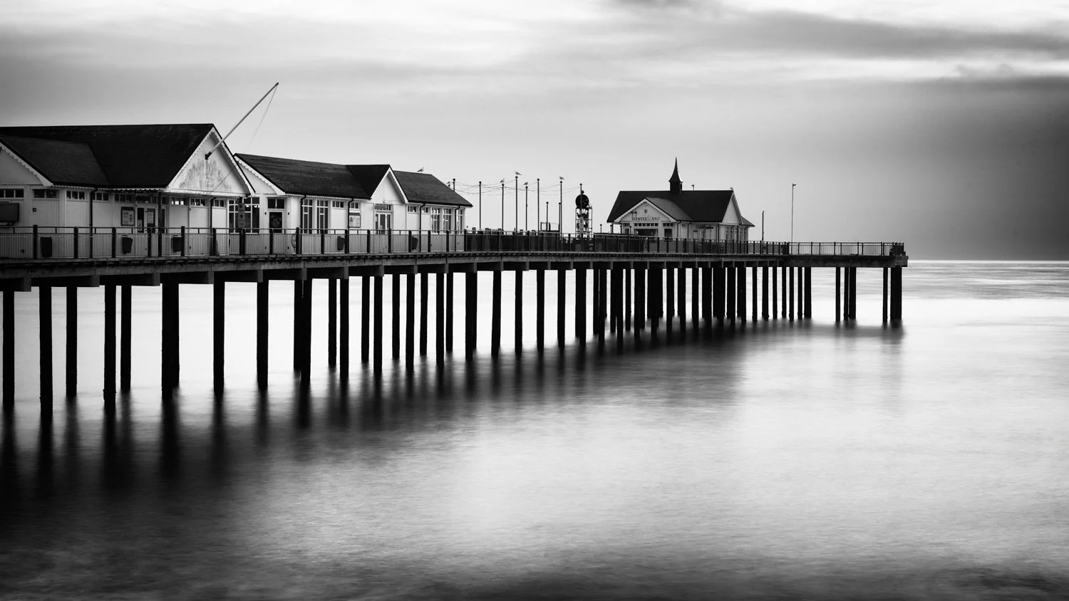 Black and white edit of Southwold Pier using restrained tones and contrast
