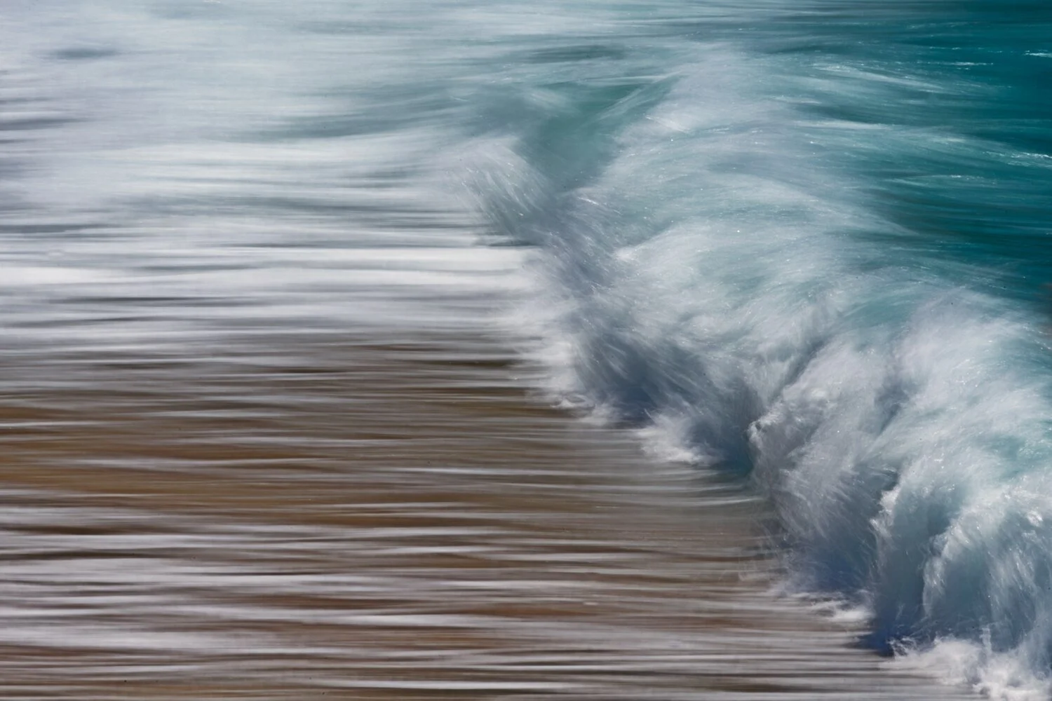 Intentional motion blur transforms a breaking wave into an expressive photograph