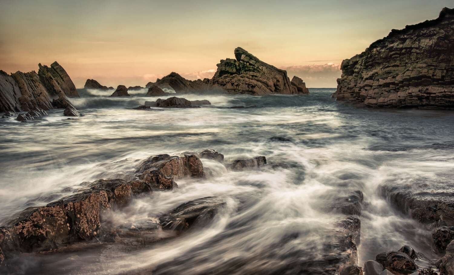 Long-exposure coastal photograph demonstrating movement and visual flow