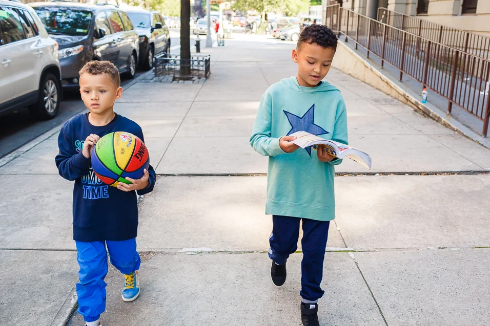 Grey with his basketball, Cash with his Pokémon book