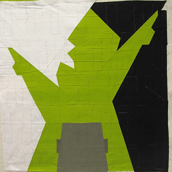 Pundit, quilt top sandwiched with backing and batting and basted