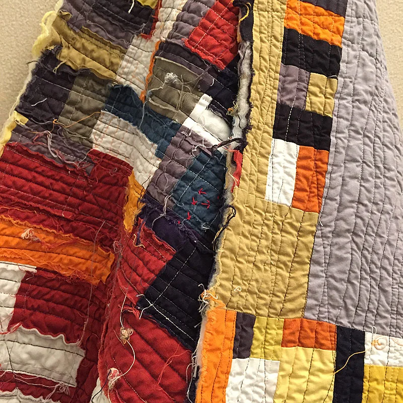 So I cut the whole in half, threw both halves into a hot washing machine and dryer to see what would happen and hung the ragged results on the design wall until I could face it again. hmmm.....kind of liking that squinched up raggedness.......