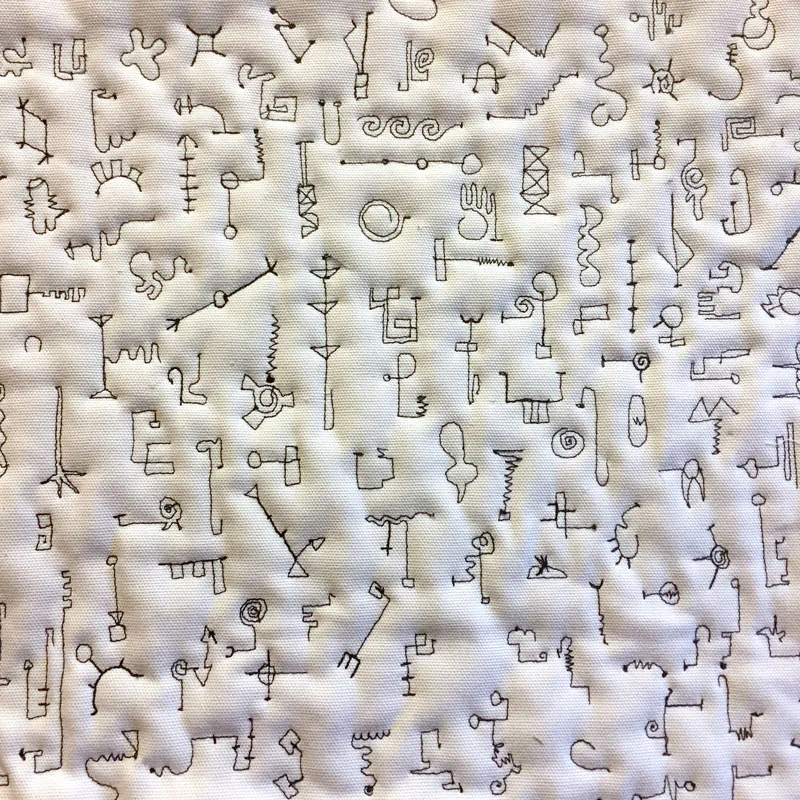 The challenge of making each one different slowed me down. I couldn't do more that 20 at a time without finding myself repeating marks. Some look like things, some look like letter characters. I let the thread tell me their character.