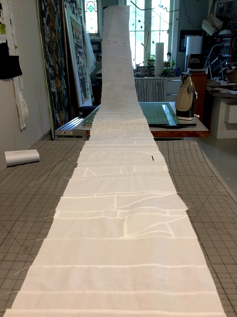  It started with a box of white cloth scraps. I assembled them roughly into a 16 foot scroll. 