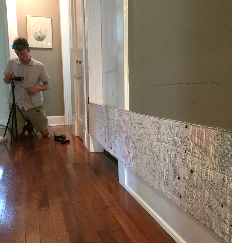  With the scroll finished I enlisted my son to do a video of it. We taped it to the hallway wall, mounted a camera to a skateboard and recorded a non-stop video. It gave me an idea of what the scroll would look like in motion. 