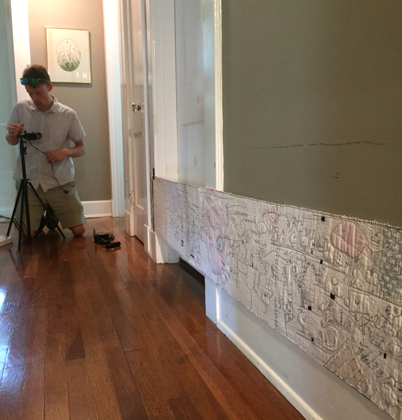 With the scroll finished I enlisted my son to do a video of it. We taped it to the hallway wall, mounted a camera to a skateboard and recorded a non-stop video. It gave me an idea of what the scroll would look like in motion.