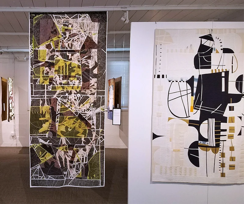 Disruption, at left, will be traveling with Quilt National 2019 for the next few years. It is two-sided.