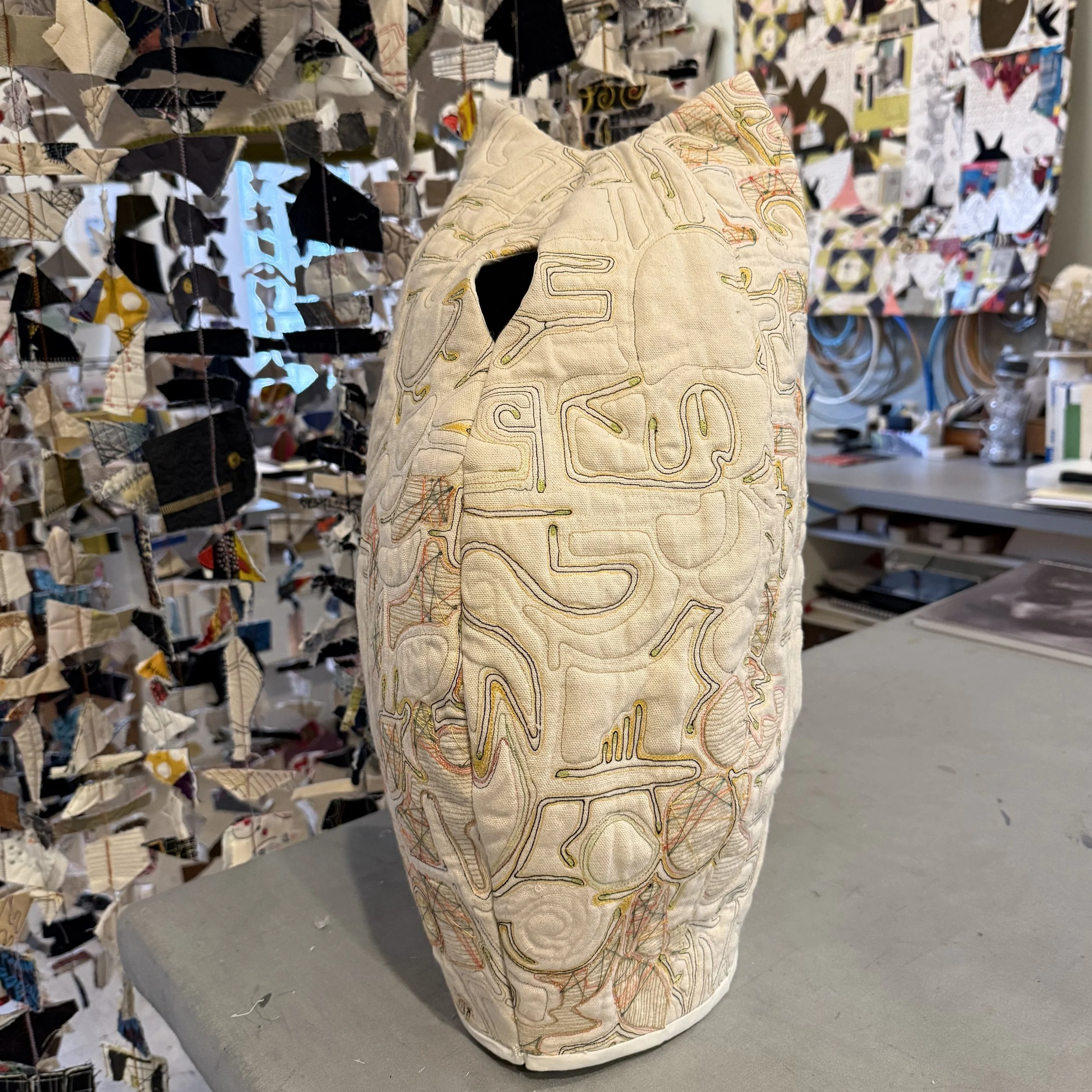 Fiber art sculpture with oval mouth