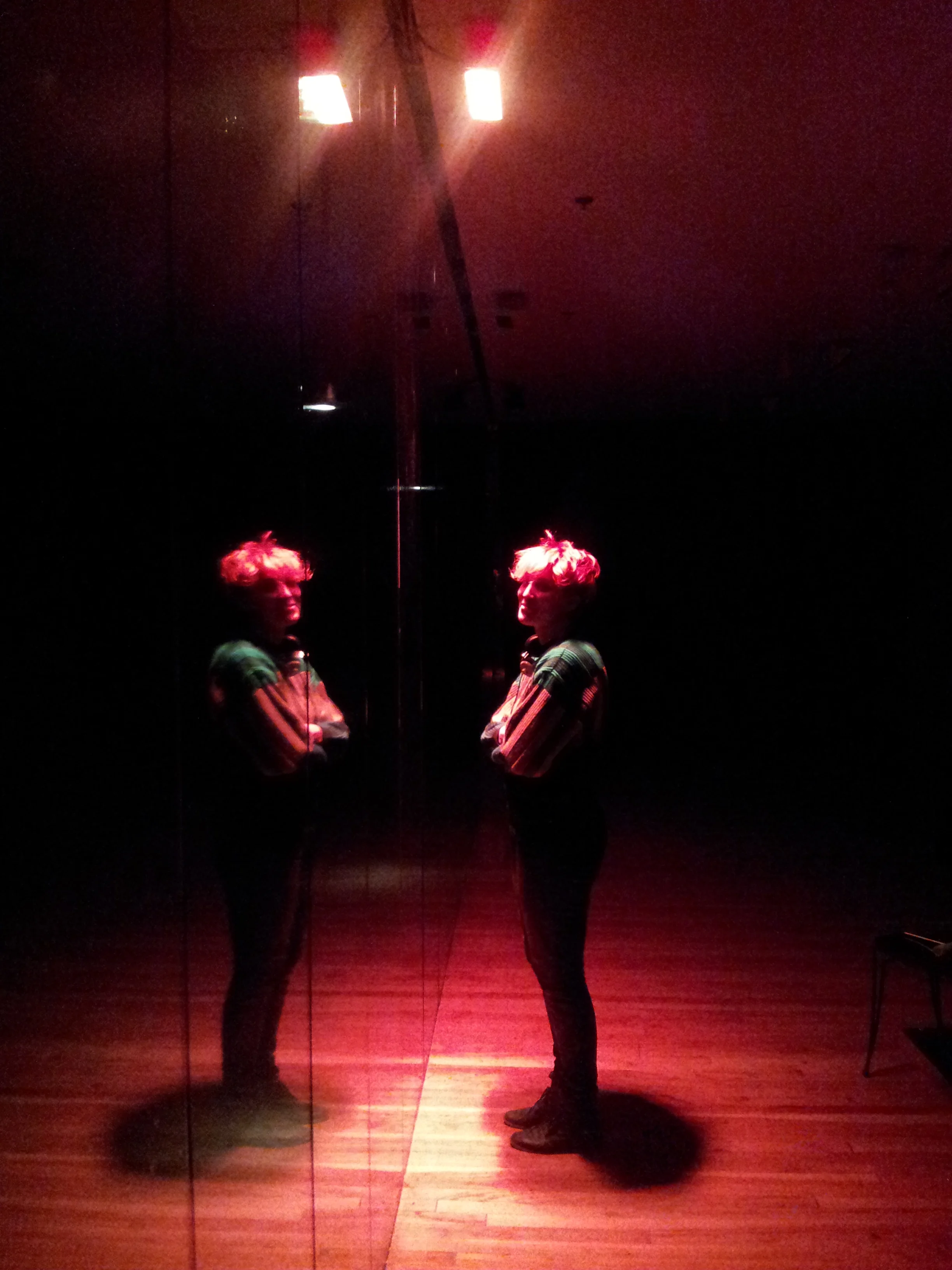 inside glass room: dmx controlled led lights illuminate with colors and timing according to john cage piece