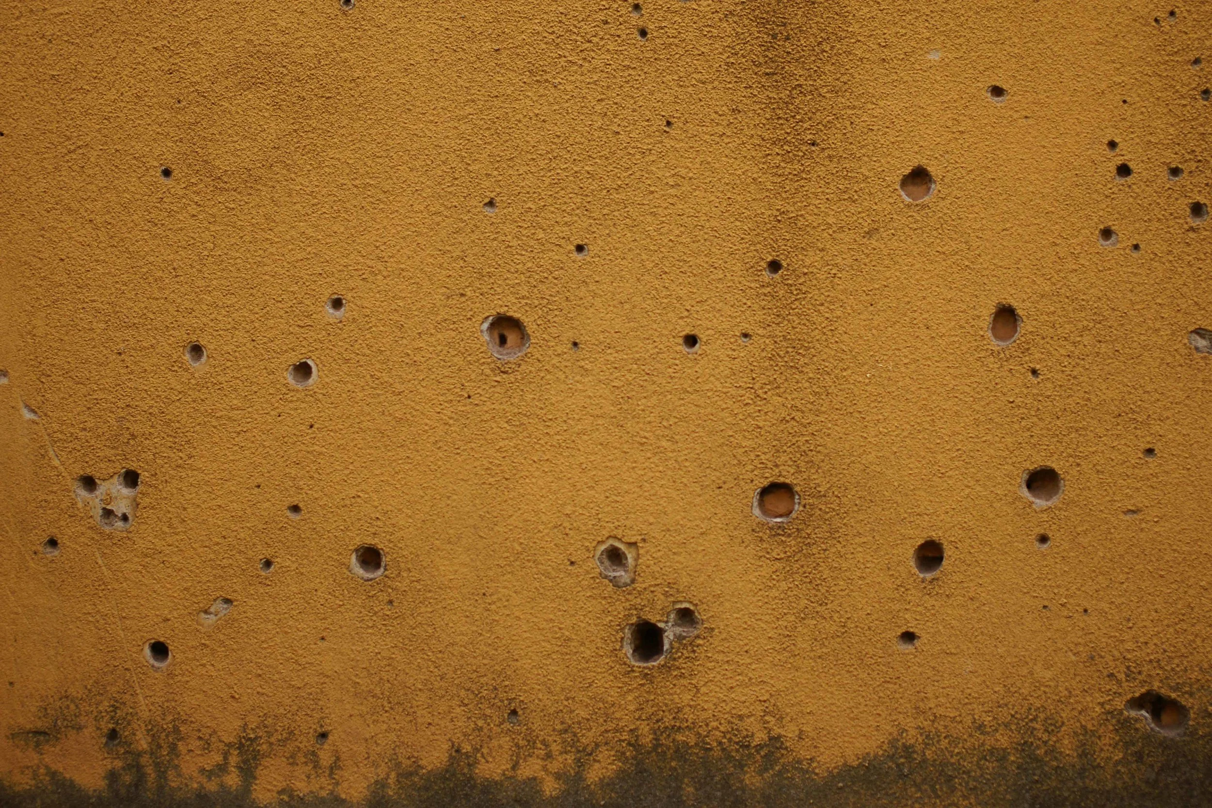 Bullet holes serve as a poignant reminder to a dark but recent past. "There were bodies just lying in the street, blood everywhere," says Kibe.
