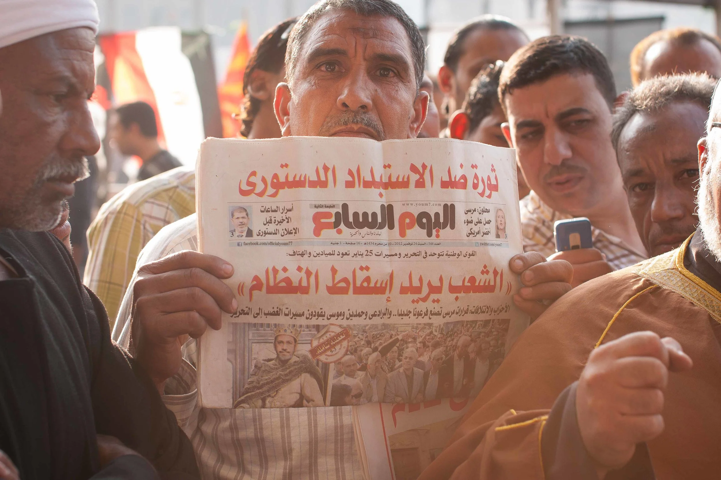 Other than the light, the one thing I love about this picture is the small photo of Morsi wearing a crown. Enough said.