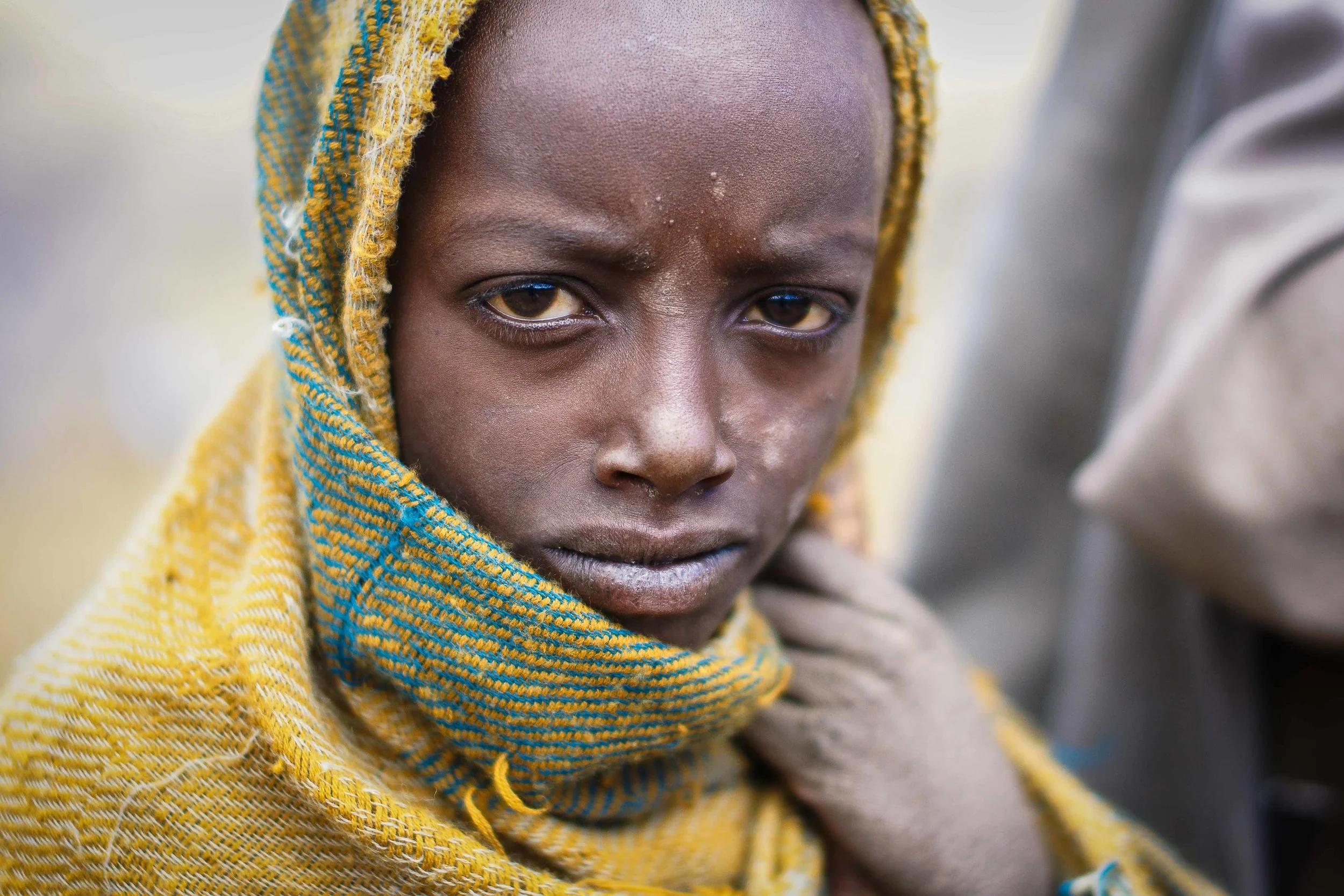 Passing through a small gathering of goatherds and a musician, this child's gaze and intensity was something that I had to photograph. Fortunately, he obliged.