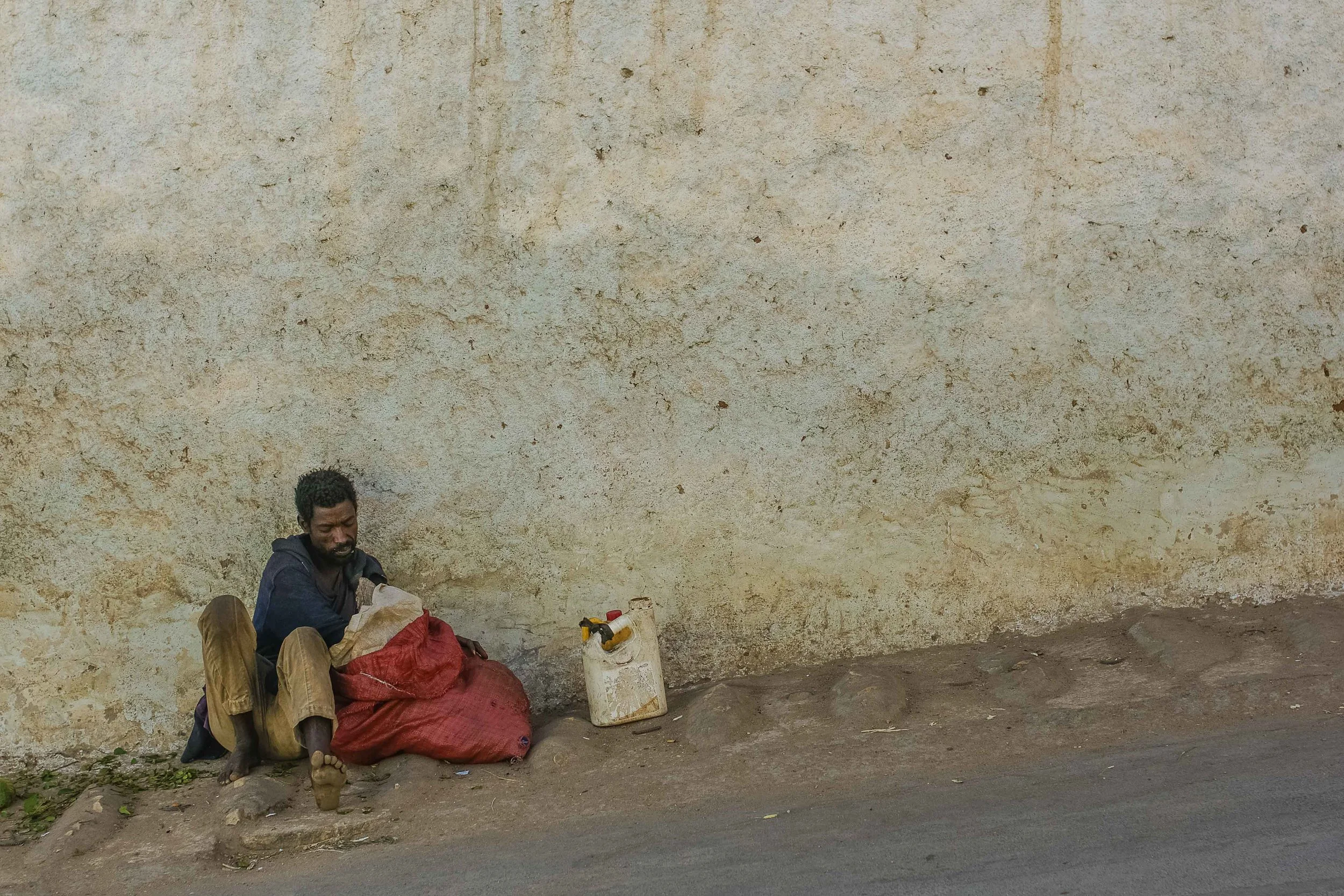An all-too-familiar sight. There was one man who rarely left the corner near our guesthouse, and every time we passed by, a handful of green leaves were at his side.