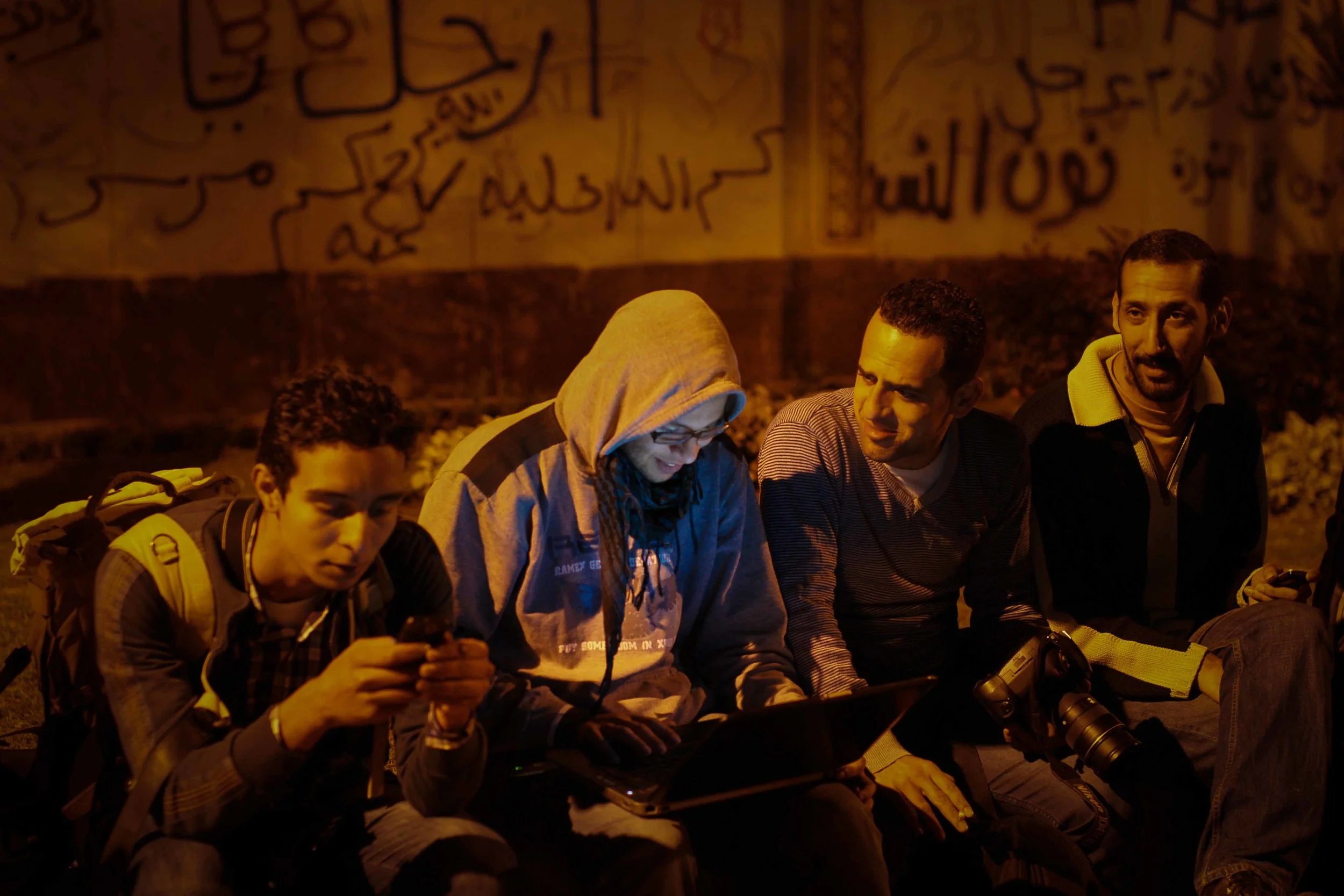 News photographers wait for the crowds to grow. For the early part of the night, it became photographer social hour.