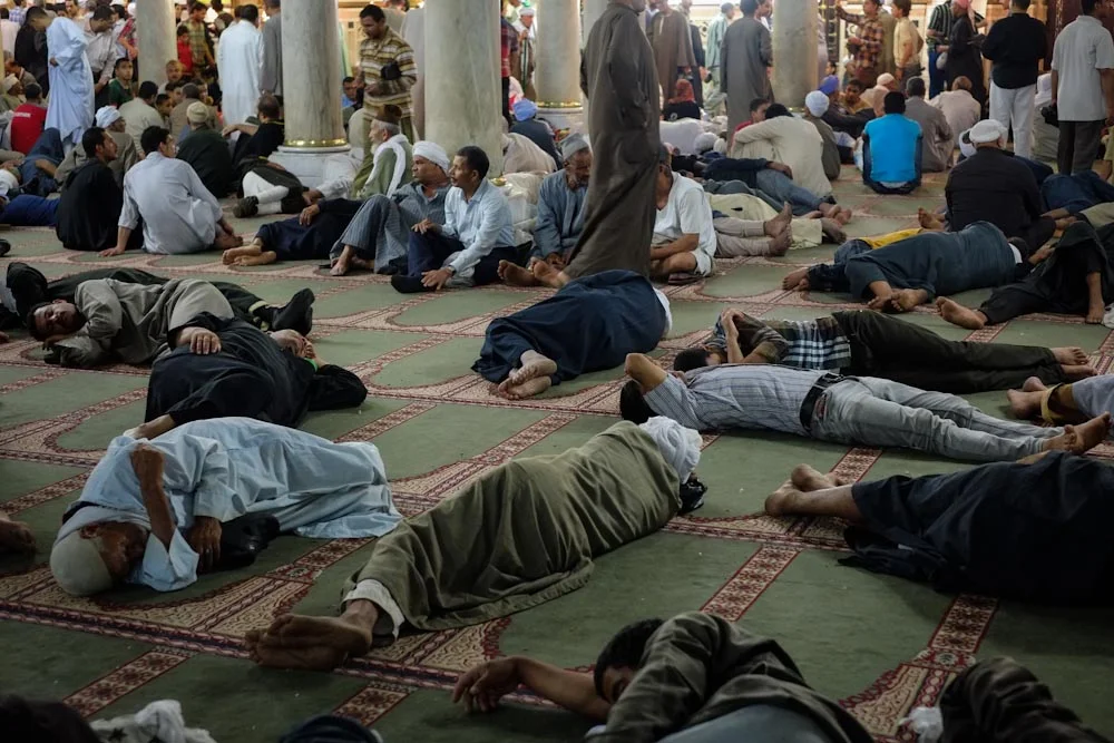 Pilgrims rest from their journey and the heat of the evening.