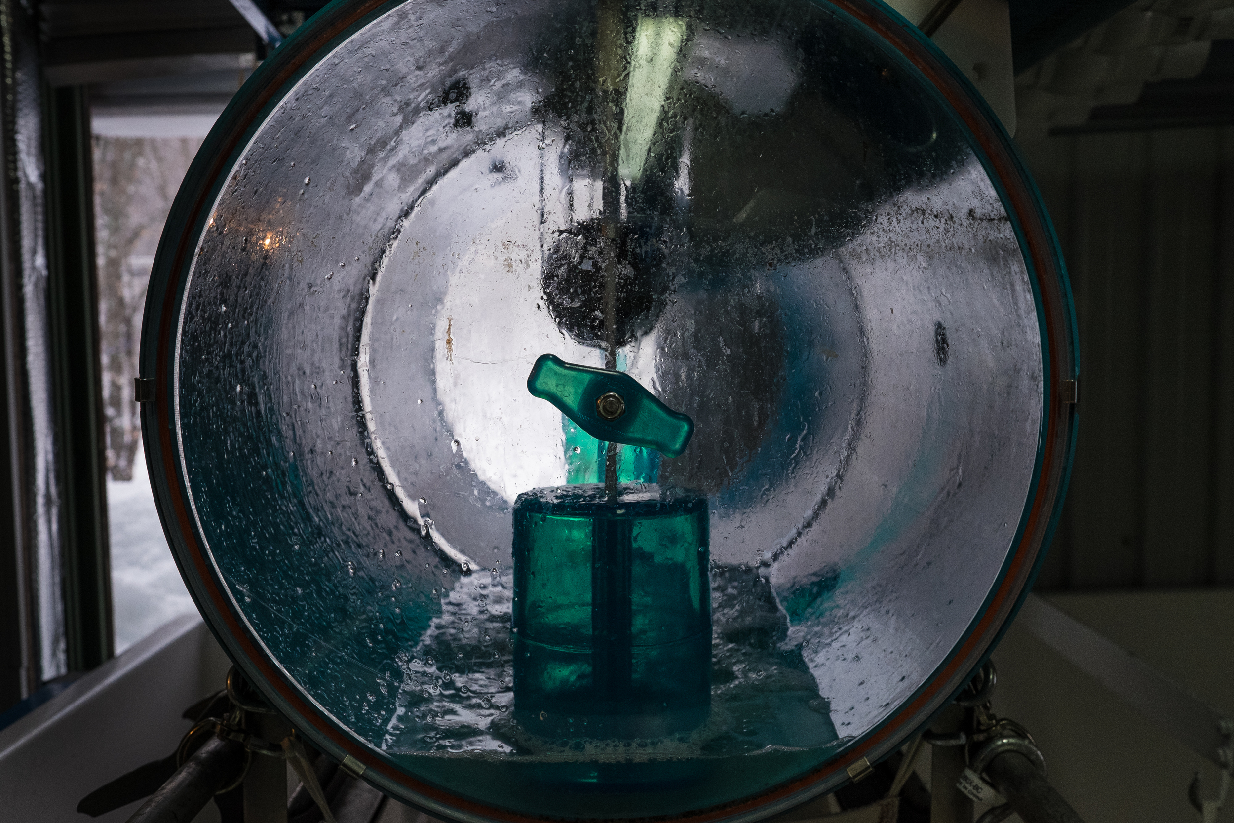 Sap pours into a collection barrel, drawn in from the trees through vacuum pumps. The sap is clear when it is first harvested. It acquires a golden brown color during the production process. Leyland Cecco/Al Jazeera America