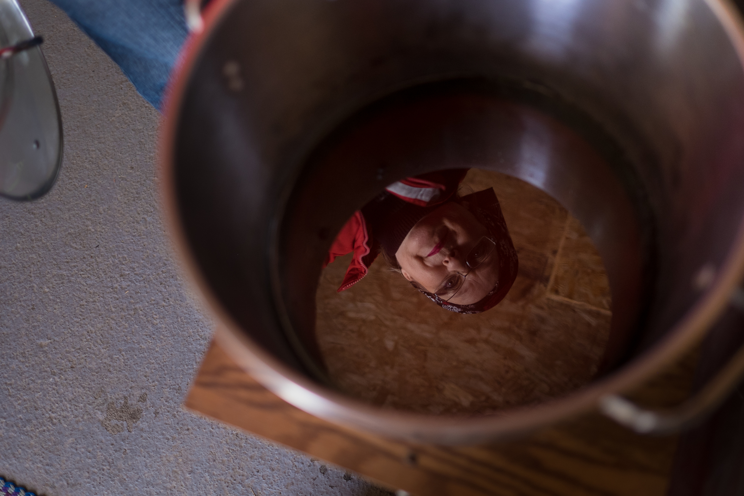 Sugar shack operator Simone Vezina is reflected in a new batch of maple syrup. Leyland Cecco