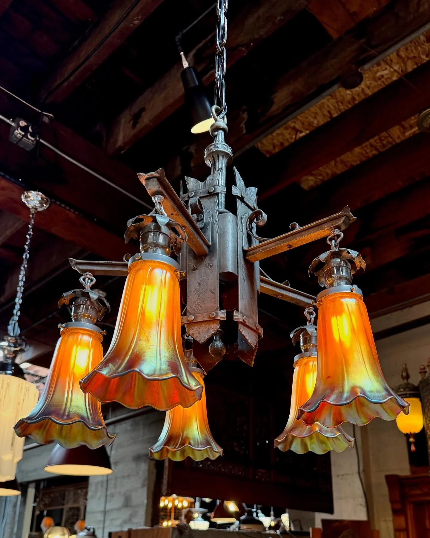 This beauty sure turned out nice!
We paired this antique c.1920 iron light fixture with a set of vintage hand blown art glass shades. They may have been made decades apart, but the combination really works!