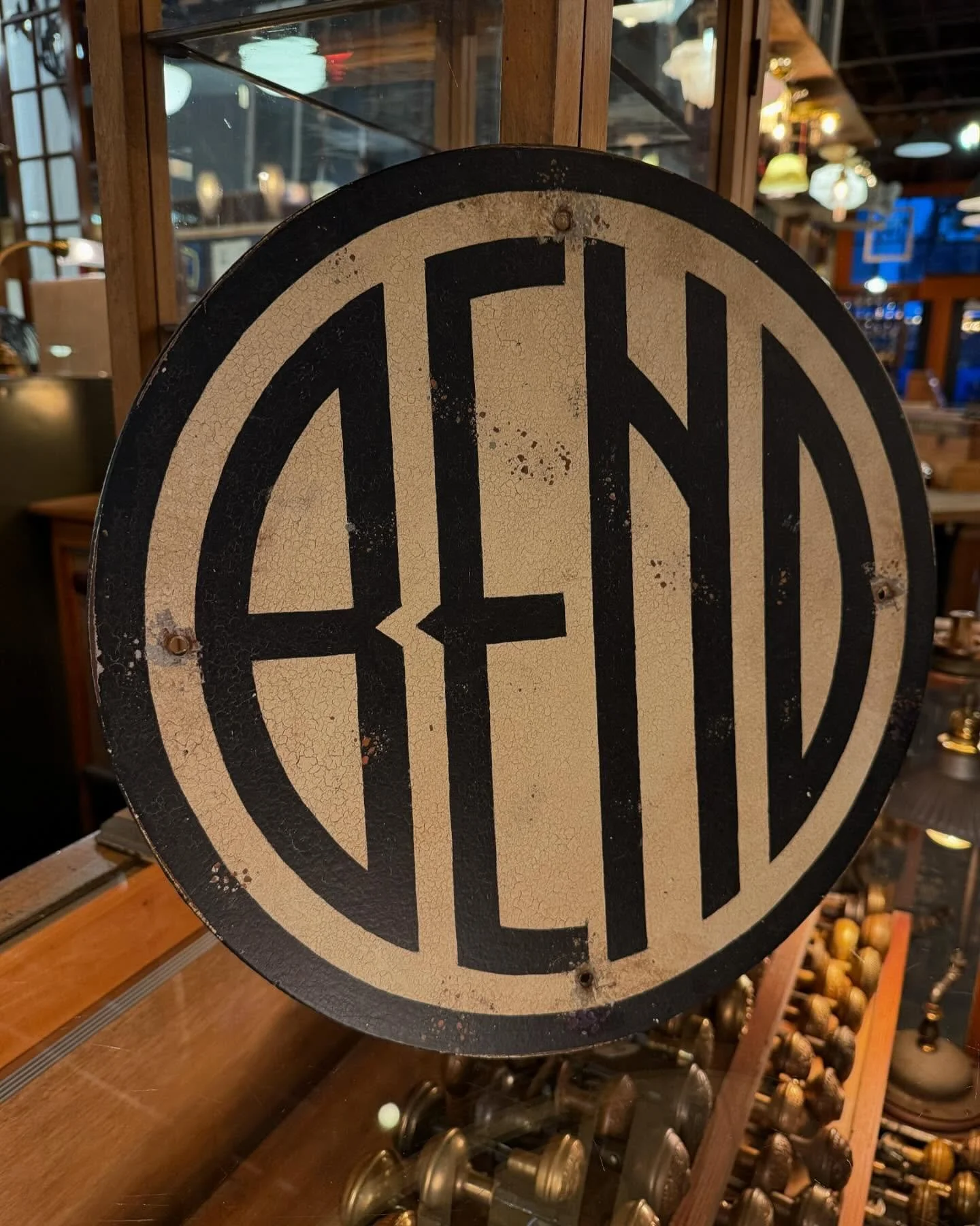 A little piece of iconic Central Oregon history! 
We&rsquo;re estimating that this 15 1/2&rdquo; round &ldquo;BEND&rsquo; sign dates from the 30&rsquo;s or 40&rsquo;s. The aged paint on Masonite is perfectly crazed for the sign&rsquo;s age.  Definite