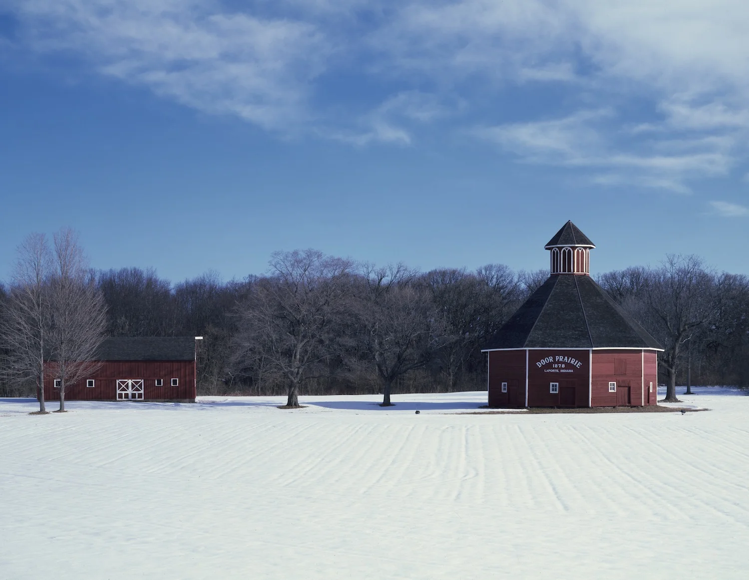 A polyhedron, or multi-sided, barn is this nine-sided example in La Porte, Indiana (year unknown). Image via Library of Congress.