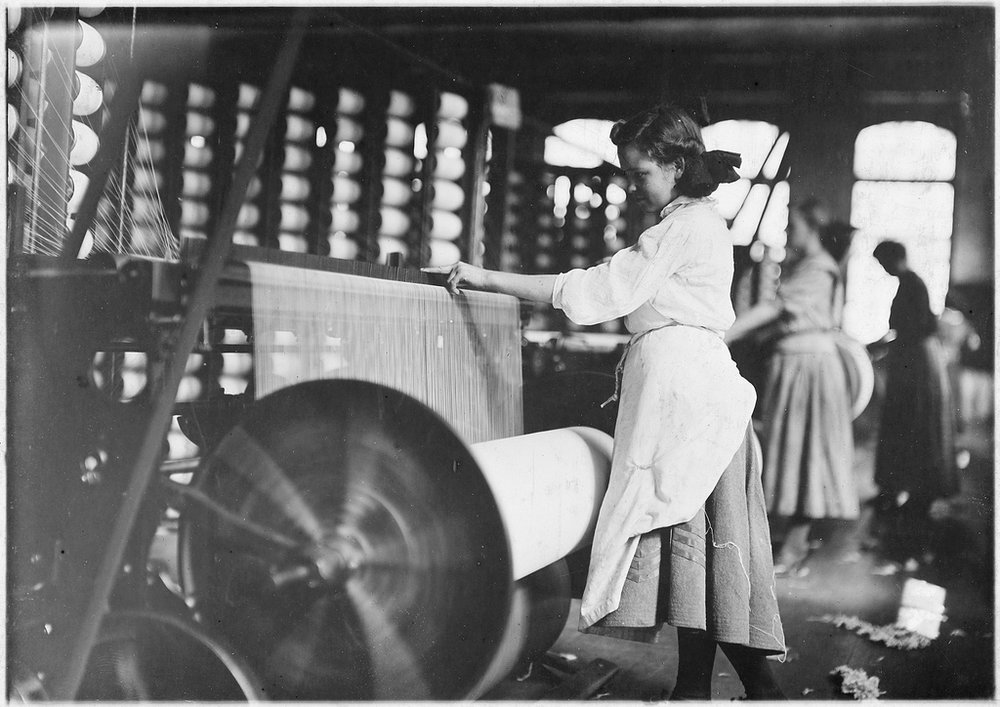  Girls at Weaving Machines, Evansville, Ind. (1908). Image by Lewis Hine via National Archives and Records Administration. 