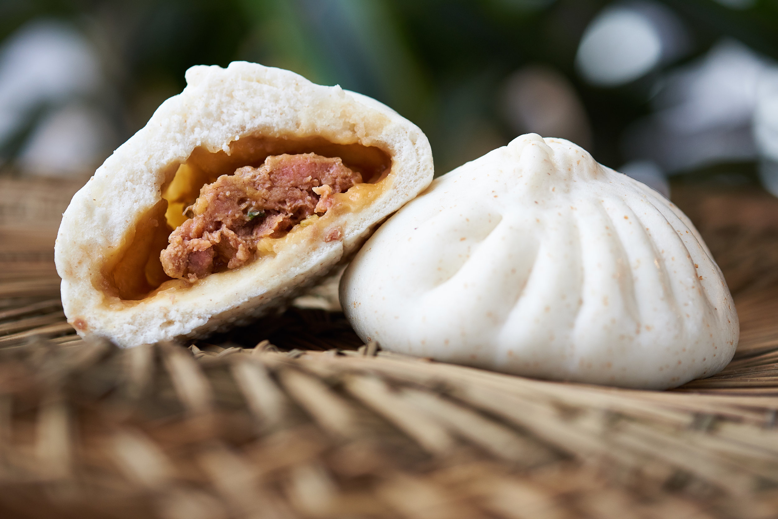 Professional food photo of a juicy pork bao bao. Commercial photography